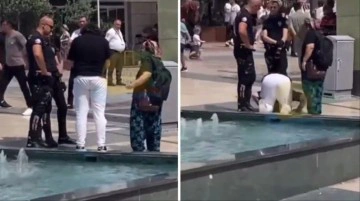 Polislerin zor anları! Gözaltına almak istedikleri kişi havuz başında namaza durdu